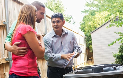 PCO consulting with homeowner couple.